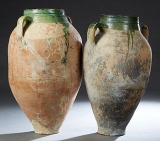 Near Pair of French Provincial Partially Glazed Earthenware Oil Jars, late 19th c., with ring handles, Largest- H.- 24 1/2 in., Dia.- 14 1/2 in. Prove