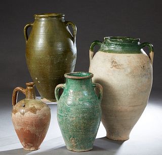 Group of Four Provincial Partially Glazed Pottery Baluster Jars, 20th c., three with double applied ring handles, one with a single ring handle, Large