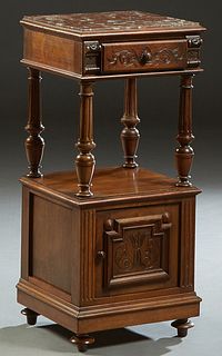 French Henri II Style Carved Walnut Marble Top Nightstand, early 20th c., the inset highly figured brown marble over a frieze drawer, on turned tapere