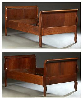 Pair of French Provincial Carved Mahogany Daybeds, 19th c., the scrolled head and foot boards joined by wooden rails, H.- 39 in., Int. W.- 47 in., Int