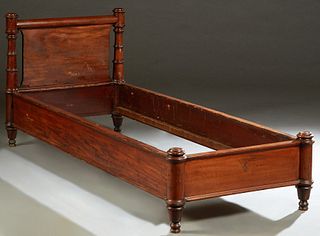 Carved Mahogany Daybed, 19th c., the curved top headboard joining turned tapered supports to wooden rails, and a low footboard with like supports, H.-