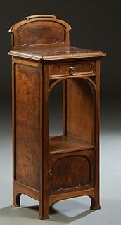 French Carved Walnut Art Nouveau Marble Top Nightstand, early 20th c., the arched back over an inset highly figured rouge marble, above a frieze drawe