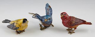 Group of Three Jay Strongwater Enameled Bronze Birds, 20th c., one red, one blue, one yellow, each signed on the underside of the tail, Blue- H.- 2 3/