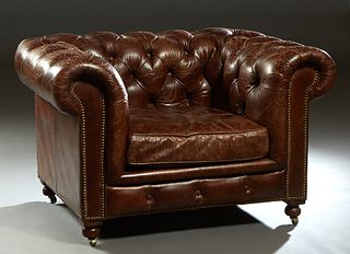 Brown Leather Chesterfield Style Club Chair, 20th c. with a tufted rolled back and arms, with iron tack decoration, on turned legs, H.- 31 in., W.- 48