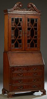 Inlaid Mahogany Secretary Bookcase, late 20th c., the pierced broken arch crest over double mullioned glazed doors, atop a base with a slant front and