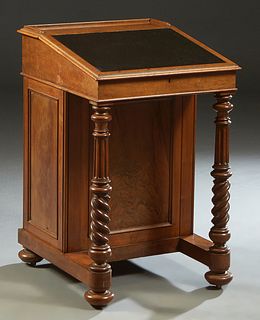 French Louis XIII Style Craved Walnut "Davenport" Desk, 19th c., the three-quarter galleried top over slanted leather inset lid opening to storage and