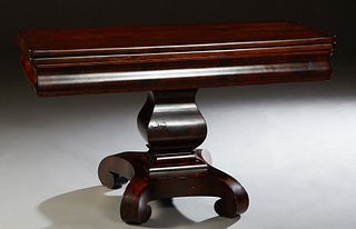 American Classical Revival Carved Mahogany Drop Leaf Dining Table, late 19th c., the folding top over a convex skirt, on a tapered four sided urn supp