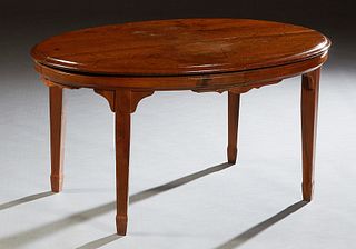 English Carved Mahogany Oval Coffee Table, 19th c., the stepped top over a scalloped skirt, on tapered square legs, cut down from a breakfast table, H