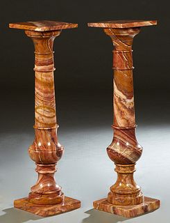 Pair of Highly Figured Rouge Marble Pedestals, 20th c., the square tops on tapered ring turned supports to square bases, H.- 39 3/8 in., W.- 10 1/4 in
