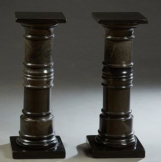 Pair of Figured Black Marble Low Pedestals, 20th c., the square top over a turned tapered support, to a square base, H.- 31 1/4 in., W.- 11 3/4 in., D