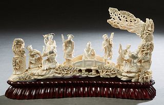 Chinese Carved Bone Bridge, early 20th c., well caved with figural and landscape decoration, on a custom carved mahogany base, H.- 7 3/4 in., W.- 15 1