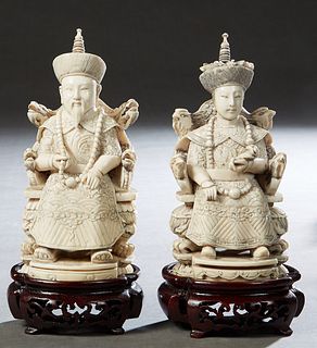 Chinese Carved Bone Seated Emperor and Empress Figures, 20th c., signed on the undersides, on custom carved mahogany stands, H.- 5 7/8 in., W.- 2 3/4 