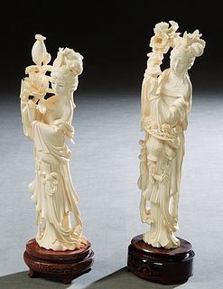 Pair of Chinese Carved Bone Kwan Yin Figures, 20th c., of women holding flowers, the larger on a pierce carved mahogany base; the smaller one on a wir