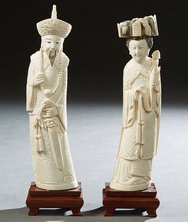 Pair of Chinese Carved Bone Figures, early 20th c., of an Emperor and Empress, with scrimshaw decoration, on stepped carved mahogany bases, Figures- H