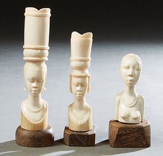 Group of Three African Carved Bone Female Heads, early 20th c., mounted on wooden bases, Tallest- H.- 9 1/4 in., Dia.- 2 5/8 in. Provenance: Palmira, 