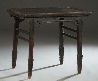 Chinese Black Lacquer Carved Elm Wine Table, early 18th c., with a drip edge, the rectangular top on tapered sword legs, over arched front and rear st