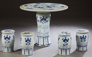 Chinese Five Piece Porcelain Patio Set, 20th c., consisting of a circular table with deer and stork decoration, and four cylindrical stools, H.- 29 1/