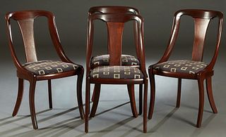Set of Four American Classical Style Carved Mahogany Gondola Dining Chairs, early 20th c., the curved canted back over a tapered curved splat, flanked