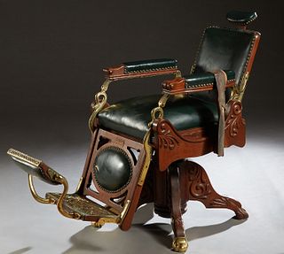 Brass and Oak Barber Chair, early 20th c., by Koken, labeled "Koken Barber Supply Co., St. Louis, with a reversible footrest, with green leather uphol