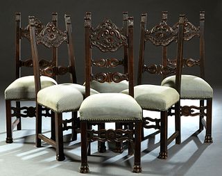 Set of Six Jacobean Style Carved Mahogany Dining Chairs, early 20th c., the high canted back with shaped relief carved horizontal splats, on cushioned