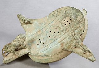 Roman Patinated Bronze Footbath, with three relief lion handles, H.- 12 in., W.- 22 in., D.- 21 in. Provenance: Palmira, the Estate of Sarkis Kaltakdj