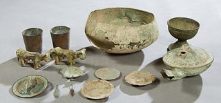 Group of Fourteen Roman Metal Objects, consisting of a pair of copper beakers; a large bronze bowl; a bronze chalice; a bronze oil lamp; two bronze co