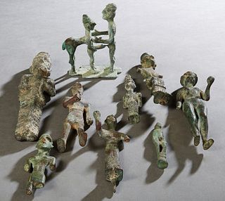 Group of Nine Roman Bronze Figures, consisting of a bearded man; a standing female nude; a centaur and a man; a small standing warrior; a seated chari