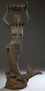 Cast Iron Garden Figure, 20th c., of a mermaid holding a planter over her head, on an integrated stepped base, H.- 63 in., W.- 29 in., D.- 13 in. Prov
