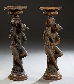 Pair of Large Patinated Bronze Figural Baluster Urns, 20th c., with winged putti on two sides over a garland draped baluster side, to a socle support 