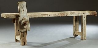 French Cabinetmaker's Work Table, 19th c., the 3 1/2 inch thick top with a wood vise on one long side, on block legs joined by rectangular block stret