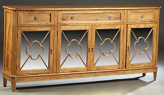 Louis XVI Style Carved Mahogany Sideboard, 20th/21st c., the canted corner top over three frieze drawer above four "clover leaf" mullioned cupboard do