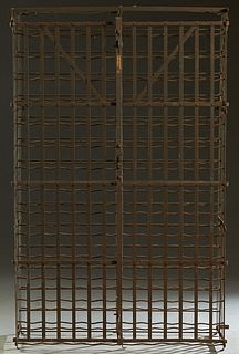 French Provincial Wrought Iron Wirework Wine Safe, 19th c., with 15 racks on each side, each rack holding five wine bottles, with double locking doors
