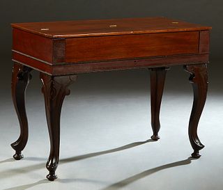 American Carved Mahogany Spinet Desk, early 20th c., the lifting lid to an interior writing surface, on large cabriole legs on turned toupie feet, H.-