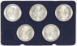 Cased Set of Five Bank Uncirculated Morgan Silver Dollars, consisting of an 1883-P, an 1884-P; an 1885-P, an 1886-P; and an 1887-P, in rigid plastic h