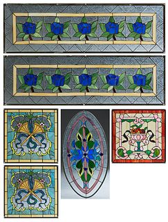 Group of Six Stained Glass Windows, consisting of a demilune transom example; two tall matching rectangular panels and panels with crossed trumpets, a
