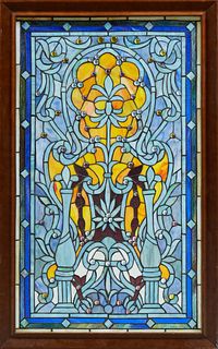 Victorian Style Leaded Glass Window, late 20th/21st c., with slag glass and cabochon "jewels," mounted in a mahogany frame, H.- 37 7/8 in., W.- 24 in.