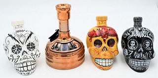 Four Bottles, to include three Kah Skull Tequila bottles along with one Sam Adams Utopia.