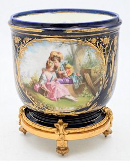 French Porcelain Cache Pot, royal blue having painted romantic scene on bronze base, height 8 1/8 inches.