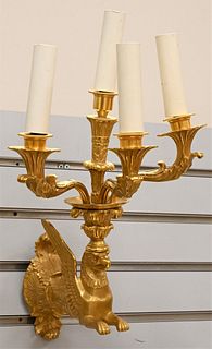 French Gilt Bronze Figural Sconce, having winged griffin support with four lights, height 18 inches, width 9 inches.