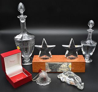 Group of Five Baccarat Pieces, to include a pair of stars on wood base; bell in original box; cat; along with two decanters; all marked Baccarat; tall