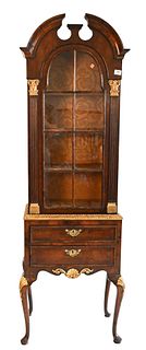 Queen Anne Style Two-Part Burlwood Cabinet, having broken arch over large glass door set on base with two drawers, height 74 inches, width 22 1/2 inch