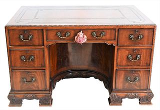 English Mahogany Kneehole Desk, having tooled leather top, concave interior kneehole area, height 30 1/2 inches, top 33 x 50 inches.