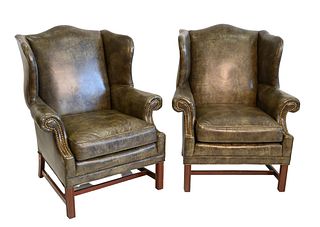 Pair of Chippendale Style Leather Upholstered Wing Chairs, on square molded legs, height 42 inches, width 35 inches, minor imperfections.
