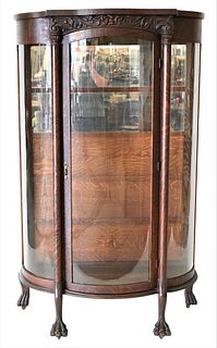 Oak Victorian Bow Glass China Cabinet, having claw feet, height 70 1/2 inches, width 41 1/2 inches.