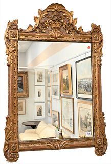 Carved Wood and Gilt Gesso Framed Mirror, having flower basket top pediment, 18th - 19th century, 46 x 29 1/2 inches.