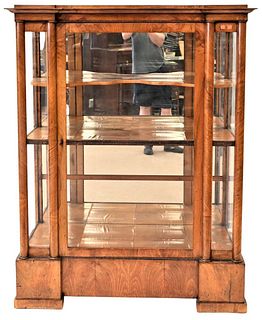 Walnut Vitrine Attributed to Biedermeier, having glazed glass door, flaked by column pilasters and glazed glass side panels, mirrored back and molded 