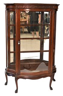 Mahogany Victorian Crystal Cabinet, having serpentine glass doors and sides, glass shelves with mirror back, height 64 inches, width 43 inches.