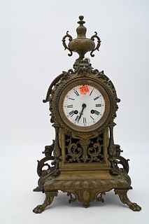 French Brass Mantel Clock, having white enameled dial, height 18 1/4 inches.