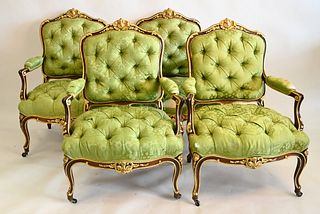 Set of Four Louis XV Style Fauteuil, having tufted upholstery and gilt decoration (upholstery worn and torn), height 39 inches, width 28 inches.