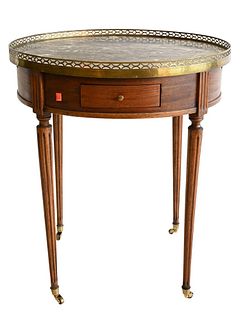 Louis XVI Style Center Table, having marble top and brass gallery, set on tapered legs ending in casters, (cracks to top), height 25 1/2 inches, diame